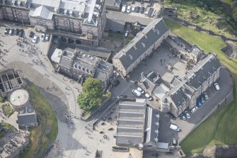 Oblique aerial view of Edinburgh Castle centred on the National War Museum of Scotland, looking SW.
