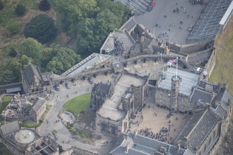 Oblique aerial view of Edinburgh Castle centred on the Scottish National War Memorial,  looking NE.