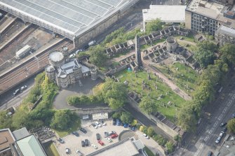 Oblique aerial view of Old Calton Burial Ground and Governor's House, looking SE.