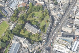 Oblique aerial view of Greyfriars Church and Churchyard, Greyfriars Place, Candlemaker Row and Magdalen Chapel, looking NW.