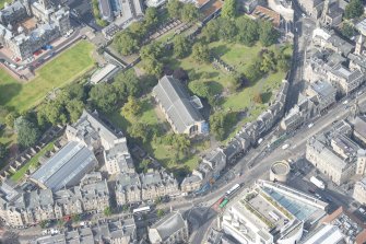 Oblique aerial view of Greyfriars Church and Churchyard, Greyfriars Place, Candlemaker Row and Magdalen Chapel, looking WNW.