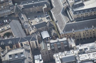 Oblique aerial view of Tailor's Hall, looking S.