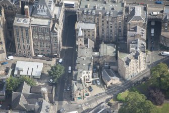 Oblique aerial view of Magdalen Chapel, looking ENE.