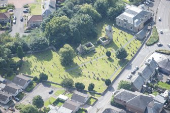 Oblique aerial view of St Kentigern's Church and Churchyard, looking SW.