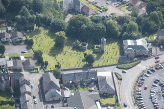 Oblique aerial view of St Kentigern's Church and Churchyard, looking SSE.