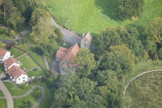Oblique aerial view of Glencorse Parish Church, looking ENE.