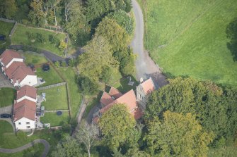 Oblique aerial view of Glencorse Parish Church, looking NE.