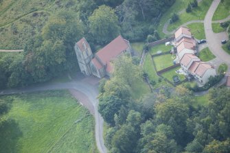 Oblique aerial view of Glencorse Parish Church, looking SW.