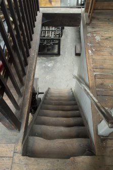 View of staircase to mezzanine at south end