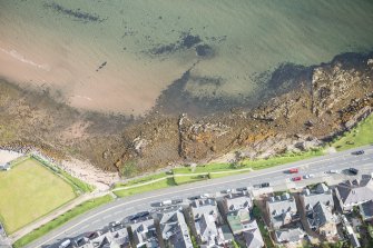Oblique aerial view of a wall in the bay at Invercloy, looking NNE.