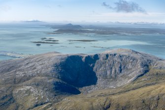 General oblique aerial view of Roineabhal with the Sound of Harris, Eabhal, Thacla and Beinn Mhor beyond, looking SSW.