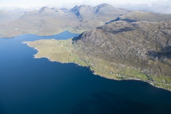 General oblique aerial view of Loch a Siar and Ardhasaig with An Clisean beyond, looking NNE.