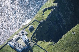 Oblique aerial view of Barra Head Lighthouse and the possible dun, looking WSW.