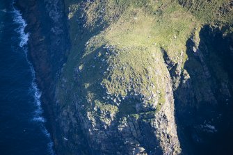 Oblique aerial view of Dun Briste, looking W.