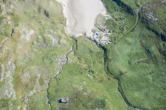 Oblique aerial view of Mingulay Chapel, Township and St Columba's Chapel, looking ESE.