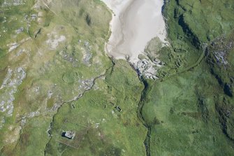 Oblique aerial view of Mingulay Chapel, Township and St Columba's Chapel, looking ESE.