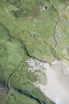 Oblique aerial view of Mingulay Chapel, Township and St Columba's Chapel, looking NW.