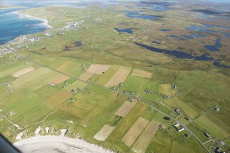 Oblique aerial view of Aird, looking E.