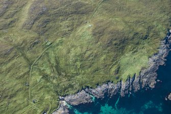 Oblique aerial view of Berneray Quay and The Aird, looking SW.