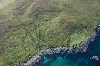 Oblique aerial view of Berneray Quay and The Aird, looking SW.