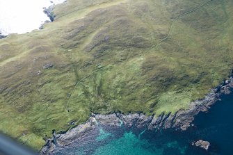 Oblique aerial view of Berneray Quay and The Aird, looking SSW.