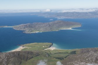 General oblique aerial view of Taransay with Luskentyre in the foreground, looking NW.