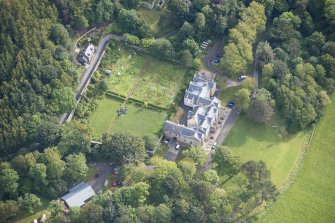 Oblique aerial view of Raasay House and walled garden, looking E.