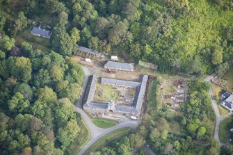 Oblique aerial view of Raasay House home farm, looking NNE.