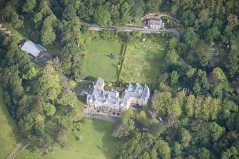Oblique aerial view of Raasay House and walled garden, looking NNE.
