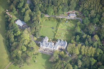 Oblique aerial view of Raasay House and walled garden, looking N.