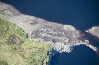 Oblique aerial view of a sheepfold and enclosure in Upper Glendevon Reservoir, looking SW.