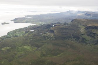 General oblique aerial view centred on the Quiraing with Staffin beyond, looking SW.