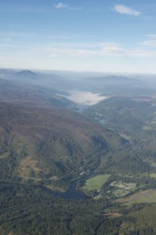 General oblique aerial view of Loch Tummel with Faskally House in the foreground and Schiehallion in the distance, looking WNW.