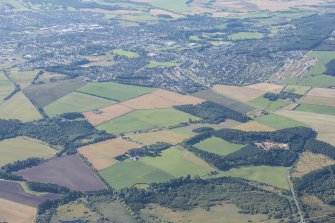 Oblique aerial view of Spynie Palace and Elgin, looking SW.