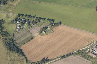 Oblique aerial view of Birnie Parish Church, looking NW.