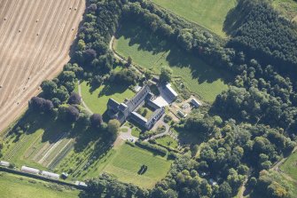 Oblique aerial view of Pluscarden Abbey, looking E.