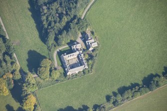 Oblique aerial view of Altyre House Stables, looking NE.