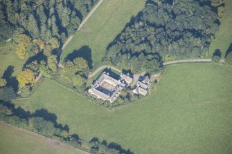 Oblique aerial view of Altyre House Stables, looking NW.