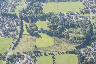 Oblique aerial view of Culloden House and Walled Garden, looking SE.