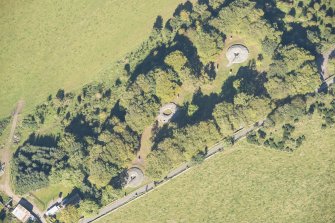 Oblique aerial view of Clava Cairns, looking N.