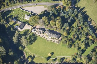 Oblique aerial view of Edinkillie House, looking NNW.