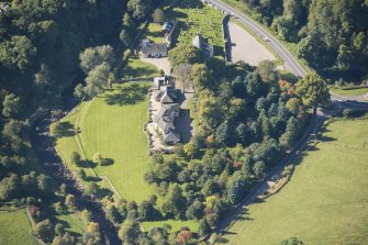 Oblique aerial view of Edinkillie House, looking W.