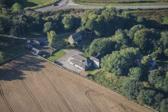 Oblique aerial view of Garlogie Mills Museum of Power and cottages, looking SW.