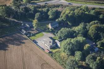 Oblique aerial view of Garlogie Mills Museum of Power and cottages, looking SSW.