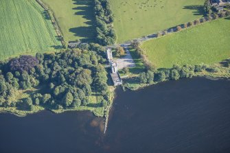 Oblique aerial view of Dunecht House Towerlodges, gates and boathouse, looking NE.