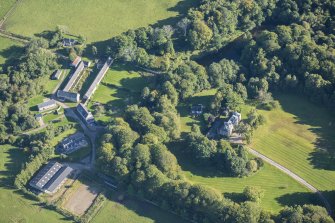 Oblique aerial view of House of Aquahorthies, walled garden, farmstead and Nether Mains of Aquahorthies, looking E.