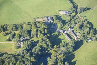 Oblique aerial view of House of Aquahorthies, walled garden, farmstead and Nether Mains of Aquahorthies, looking WSW.