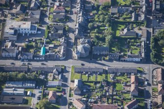 Oblique aerial view of St Margaret's School, St Margaret's Roman Catholic Church and Presbytery, looking SSW.