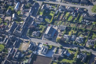 Oblique aerial view of Strathbogie Manse, TA Centre and Police Station, looking S.