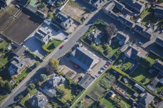 Oblique aerial view of Strathbogie Manse, TA Centre and Police Station, looking E.